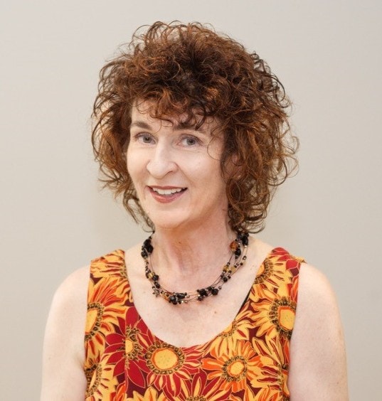 Grace life church leadership team member smiling in colorful dress.